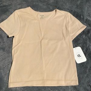 Women’s tan tight fitting T-shirt, never worn